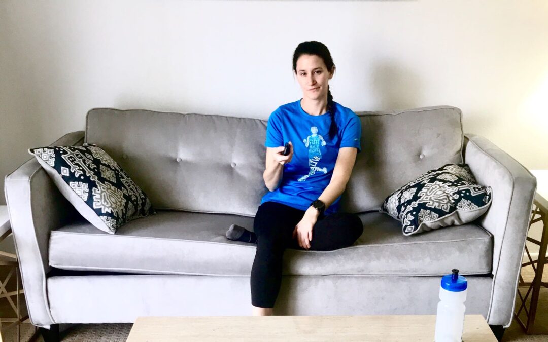Athlete sitting on sofa after workout