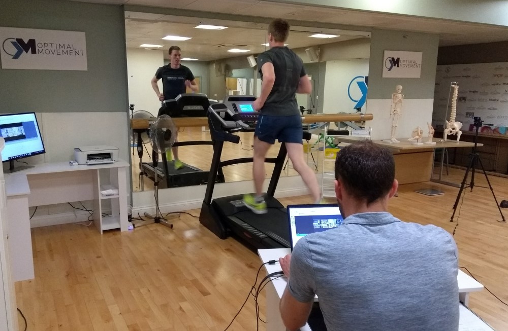 Runner on treadmill having gait analysed